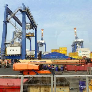a large crane sitting next to a loading dock